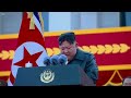 Kim Jong-Un drives missile launcher through streets of North Korea