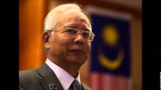 Malaysian police raid 1MDB office, PM weighs legal options