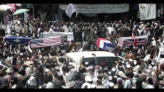 Taliban supporters hold mock U.S. funeral as troops leave Afghanistan