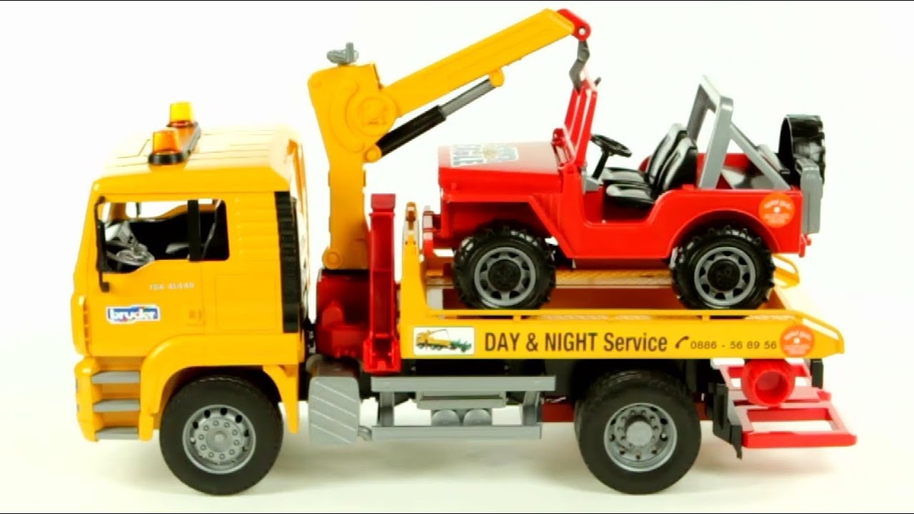 bruder man tga tow truck with cross country vehicle