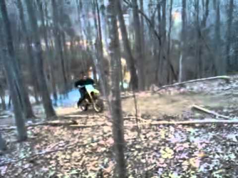 randy on the dirt bike up on the hill carver mill....
