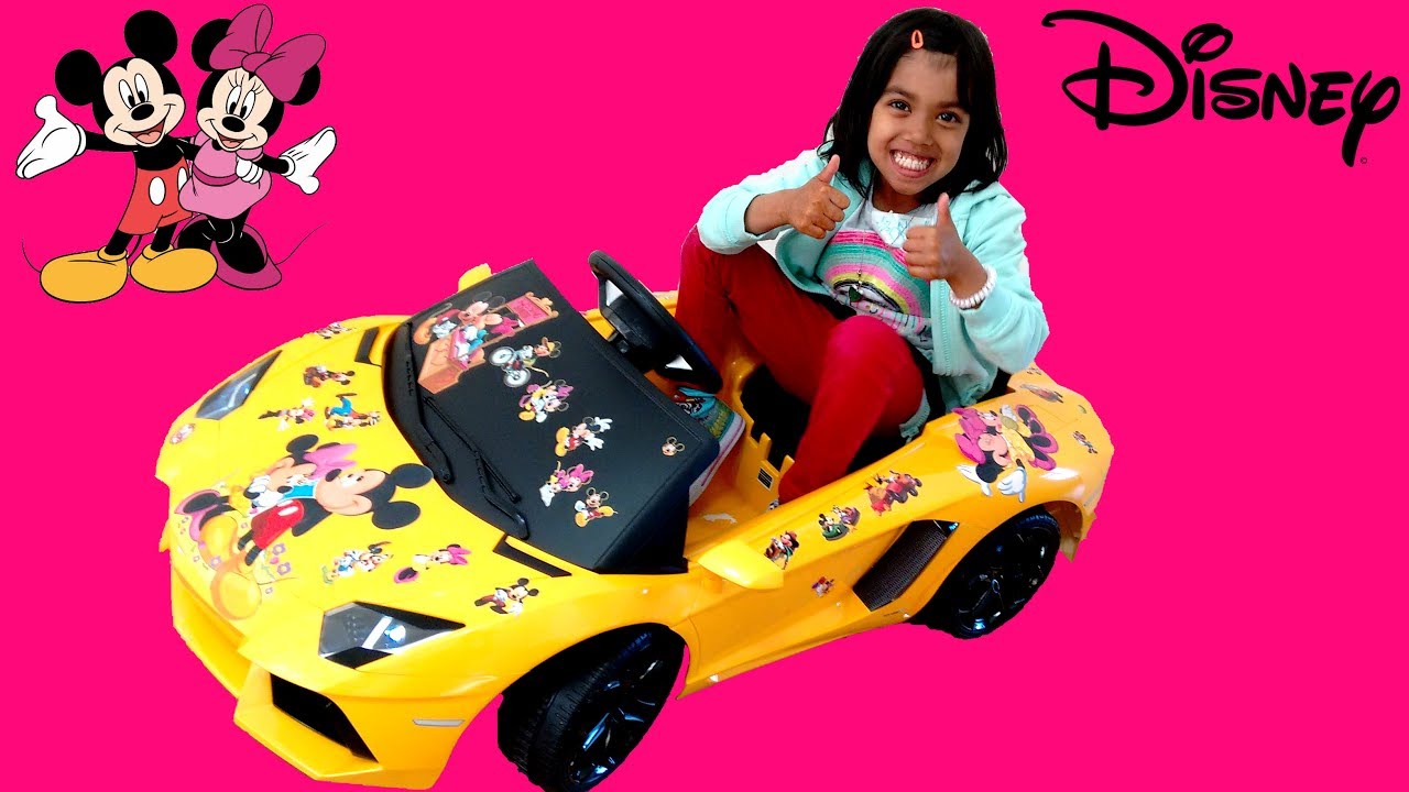 games people play Little Girl Decorating Lamborghini Aventador Ride On Car with Minnie Mickey Stickers | Disney Toy