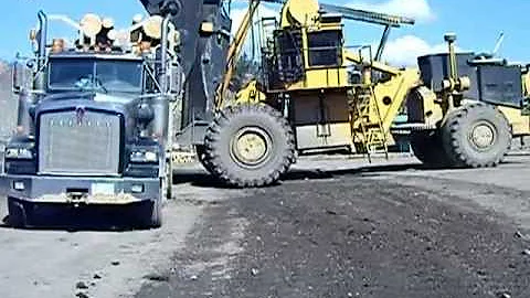 unloading a logging truck