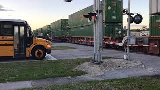 FEC TRAIN 210#3516@7:06am school bus gets in the way of the shot!
