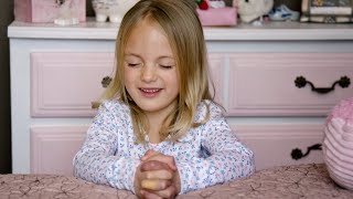 Adorable little kids praying to Heavenly Father