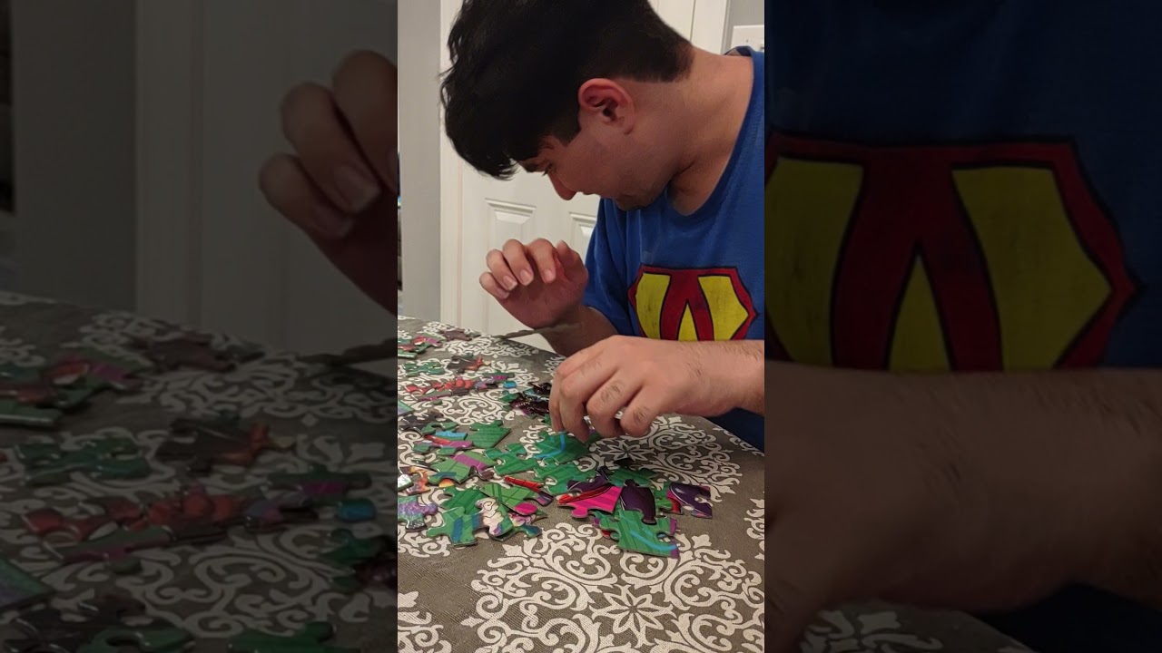 Autistic adult working on a puzzle.