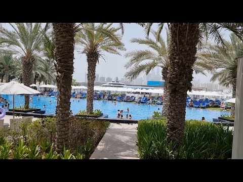 Видео: The beach at The Palm Dubai Hotel & Suites 5*  Пляж в Риксос на Пальме, Дубай, ОАЭ