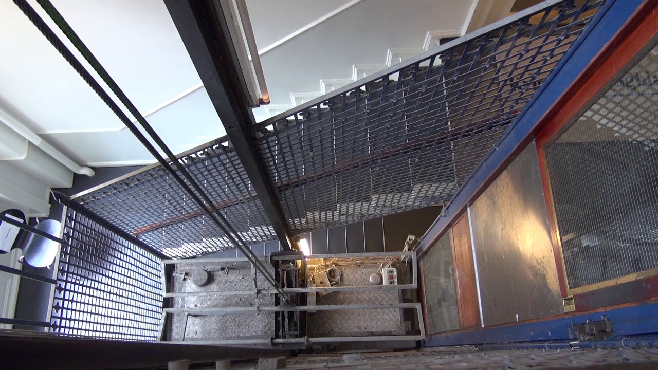 A good look at a historic Titan elevator with camera cartop ride