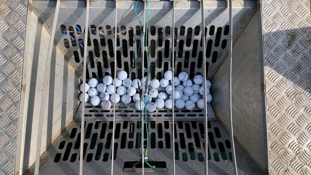 Range Balls Entering The Transport Pipe For Washing And Transportation 