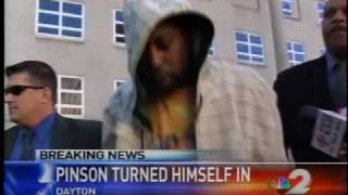 Murder suspect surrenders to police