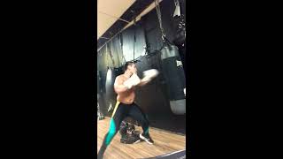 17 year old boxer hitting heavy bag work