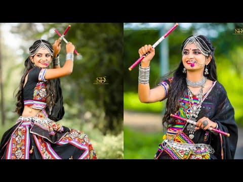 Indian traditional Gujrati Woman holding dandiya sticks For Navaratri  Festival