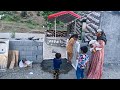 A yard door and water tank for her new home