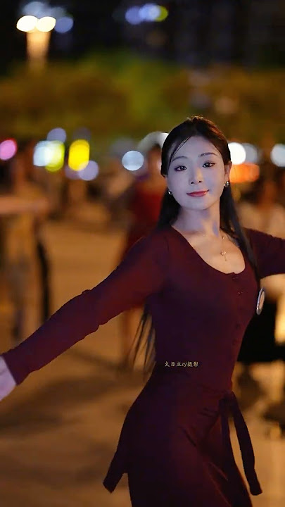 Beautiful Tibetan girl dancing gracefully
