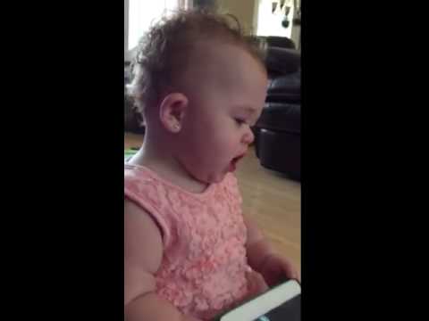 Popping bubbles with her head - YouTube