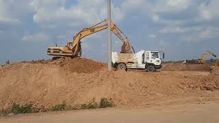 collection excavator working with truck traco hino