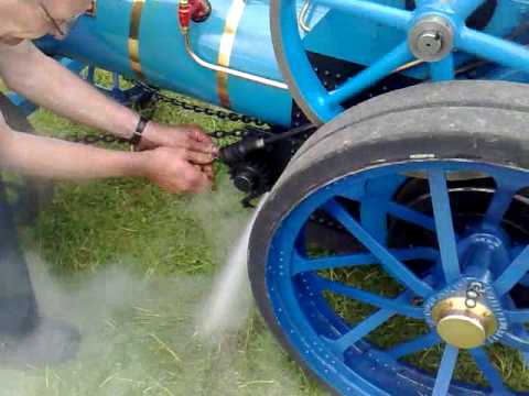 This man shows me how his traction engine works and lets off steam