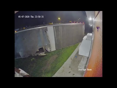 RAW VIDEO: Cows spill from truck that flips at liquor store