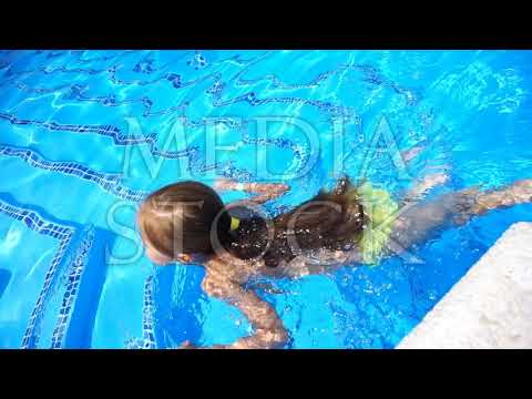 Pretty little girl swimming in outdoor pool and have a fun ▶42:16 