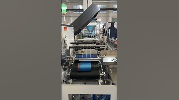 Automatic interleaved draw tape bag on roll making machine