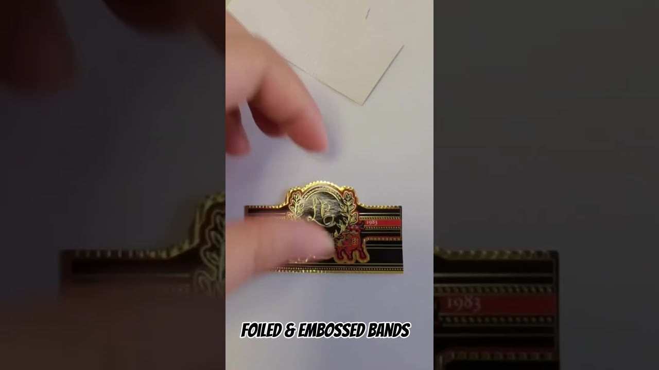 With foiled and embossed custom cigar bands. Designed and produced by us for you!