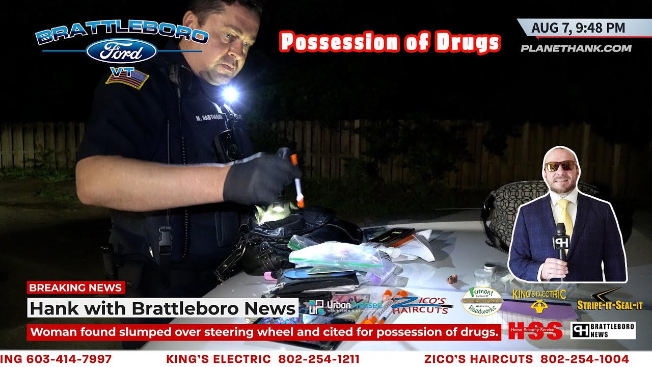 Woman found slumped over steering wheel and cited for possession of drugs. 