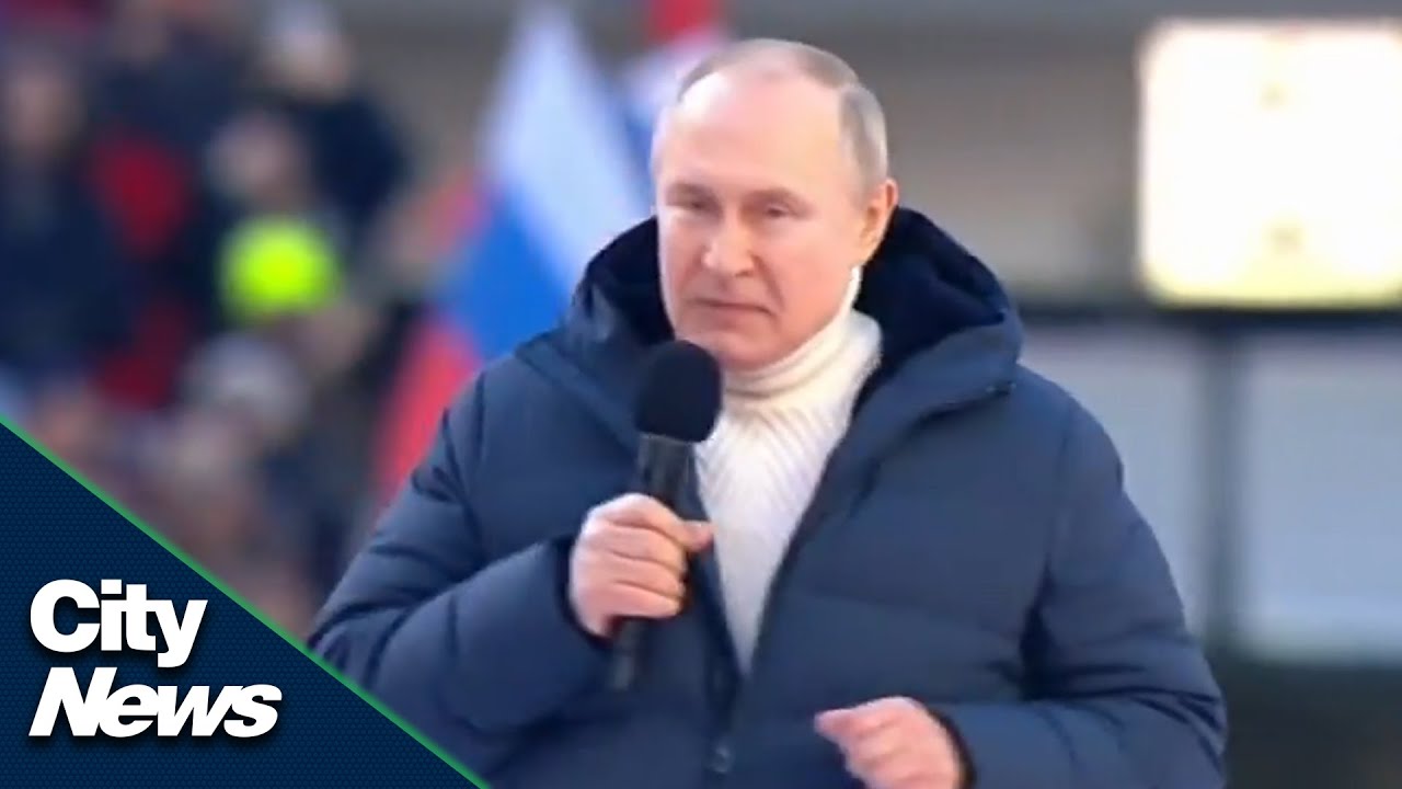Putin appears at a huge flag-waving rally inside a Moscow stadium - YouTube