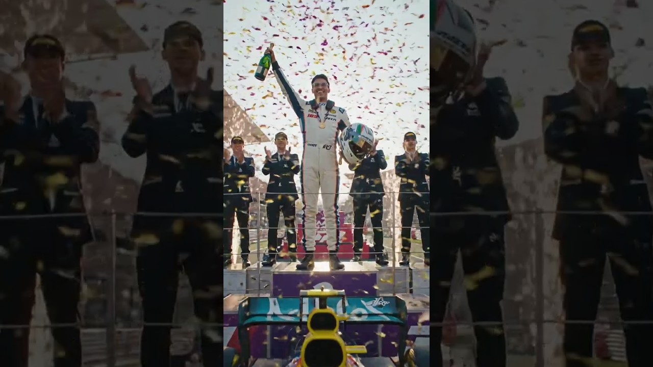 Make me a race car driver winning a Grand Prix. new 