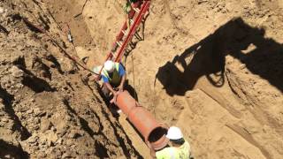installing 12-inch vitrified clay pipe