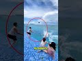 all of three people fall in water to save camera