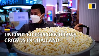 Customers fill steel vats, cardboard boxes with Thai cinema’s all-you-can-eat popcorn