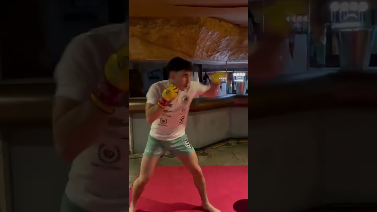 Warming up Griphouse fighter Reece McEwan before his last fight on Cage Warriors 