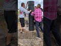 Incredible Teamwork: Group of Men Manually Installing a Large Culvert Pipe