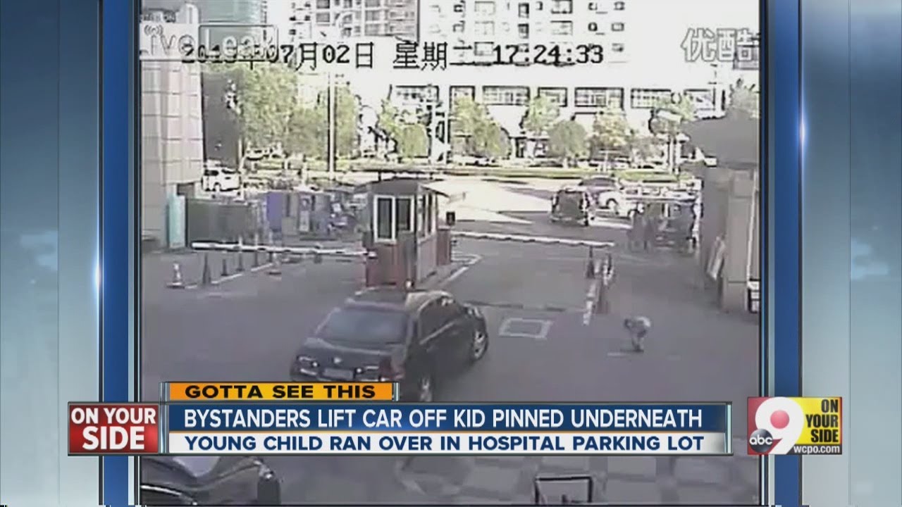 Video Bystanders lift car off child who was struck by a car YouTube