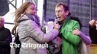 Activist wrestles mic away from Greta Thunberg over pro-Palestine chants at climate rally