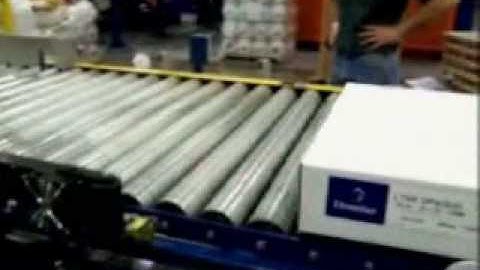 Label Printer Applicator applying labels to the side of a box