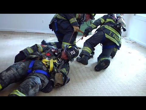 Firefighter Packing Down Firefighter Packaging and Removal #5528132273001 - YouTube