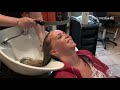 370 CY salon shampooing by young male student barber