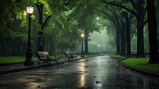 The sound of rain pouring down in the quiet park in the evening. White noise causes drowsiness.