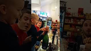 Guy pops champagne bottle that explodes on little boy