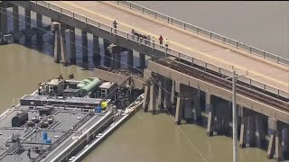 Barge hits Texas bridge, triggering partial collapse of rail trestle