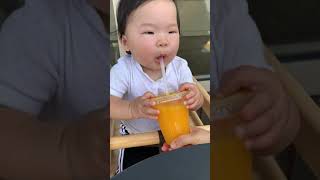 Baby tries orange juice for the first time 🍊