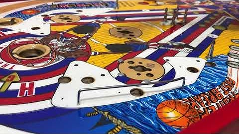 Opening clear coat pinball playfield