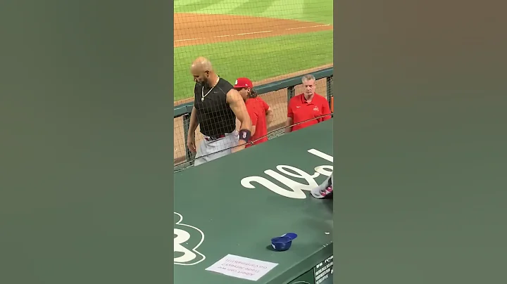 Albert Pujols giving his jersey to this young Card...