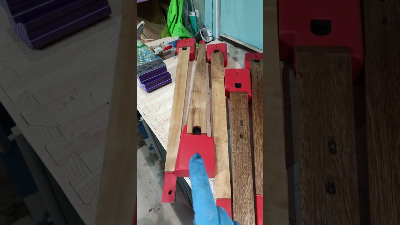 What products does this luthier use on his guitars to get a mirror finish?