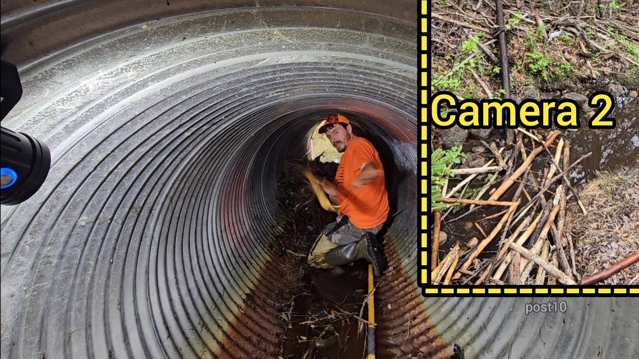 Unclogging Huge Blockage Of Sticks To Relieve Pond