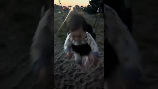 Liam's first time on the swings