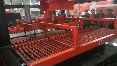 Automated sheet loading and unloading system for laser cutting machine