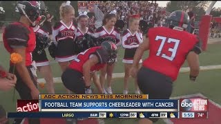 High school football players pay tribute to cancer-stricken cheerleader screenshot 5