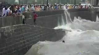 Boy Is Jumping And Swimming At Gateway Of India Sea Shore In Heavy Waves, Full Of Daring